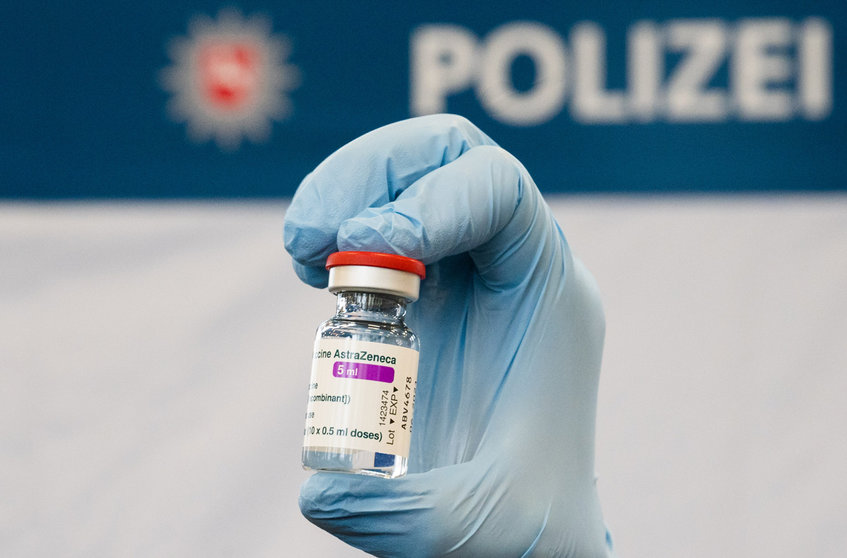FILED - 04 March 2021, Lower Saxony, Hanover: A doctor holds a vial of AstraZeneca's Covid-19 vaccine at the Lower Saxony Central Police Directorate. Germany has suspended use of the Covid-19 vaccine developed by AstraZeneca, the Health Ministry said. Photo: Julian Stratenschulte/dpa