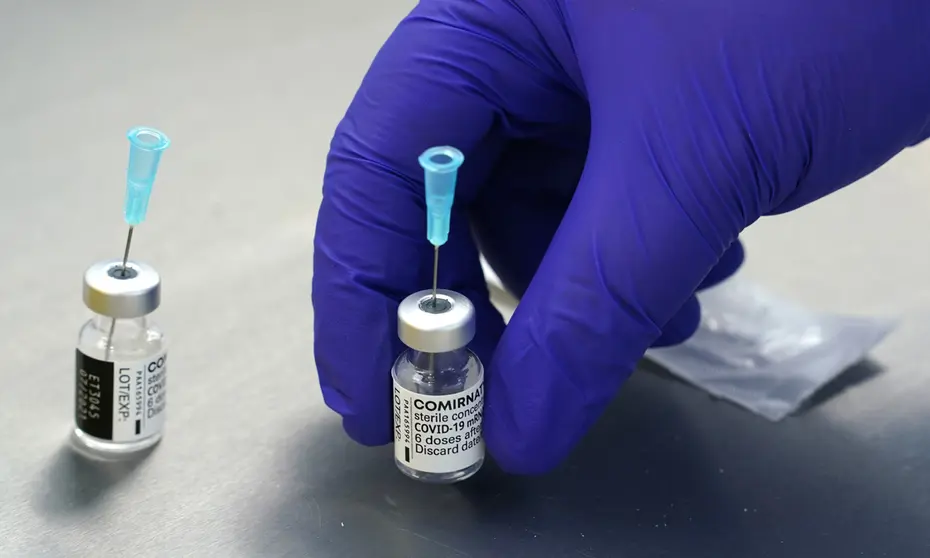 23 April 2021, Schleswig-Holstein, Husum: Empty Pfizer/BioNTech Covid-19 vaccine vials can be seen on a table in the laboratory of the Husum Vaccination Centre. Photo: Marcus Brandt/dpa