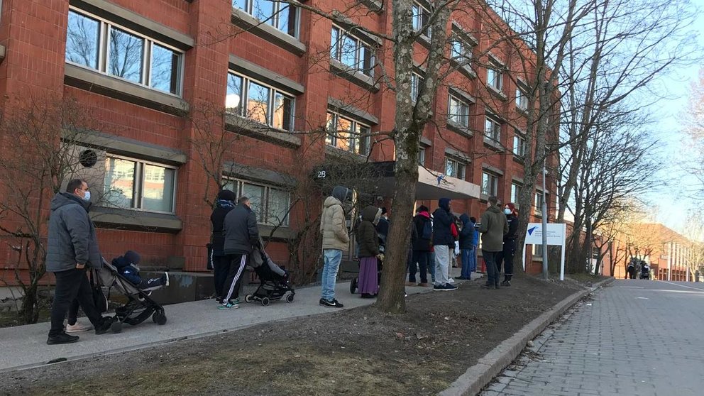 People queuing early Friday morning outside Migri's office in Helsinki. Photo: Bambi Dang.