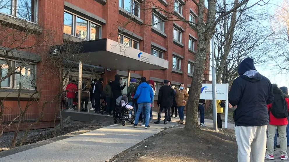 People queuing on Friday morning outside Migri's office in Helsinki. Photo: Bambi Dang.