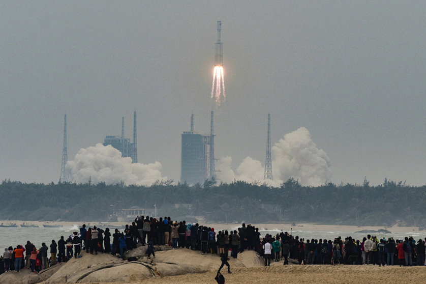 FILED - People watch China's new medium-size rocket, Long March 8, lifting from Wenchang Space Launch Center. Debris from a Chinese rocket threatens to fall to Earth in the next few days after it was used to launch the core module of China's new space station. Photo: Lu Qijian/SIPA Asia via ZUMA Wire/dpa