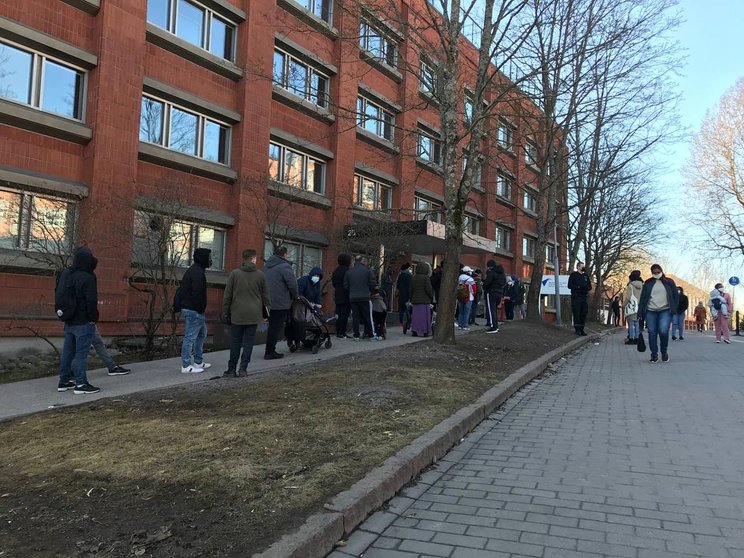 People queuing on Friday morning outside Migri's office in Helsinki. Photo: Bambi Dang.