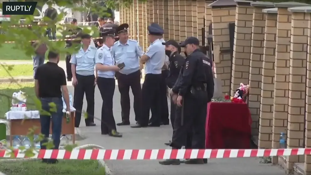 Russian police in front of the school where the massacre took place. Image: screenshot of Ruptly's live broadcast.