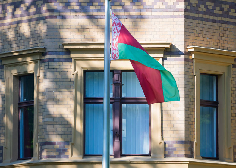 24 May 2021, Berlin: The national flag of Belarus flies in front of the Belarusian embassy in Berlin. The EU has strongly condemned the forced landing of a scheduled flight by Belarusian authorities in Minsk and held out the prospect of sanctions against those responsible. Belarusian authorities dispatched a fighter jet to force a Ryanair flight to divert to Minsk, where Roman Protasevich, a Belarusian journalist and opposition activist, who was on board was then arrested. Photo: Christoph Soeder/dpa