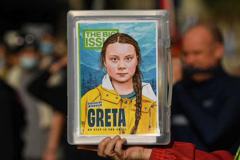 21 May 2021, Austria, Melbourne: A protester holds a poster of the Swedish climate activist Greta Thunberg during the School Strike 4 Life protest. Students across the country are calling on the federal government to stop using taxpayer money for fossil fuels. Photo: James Ross/AAP/dpa