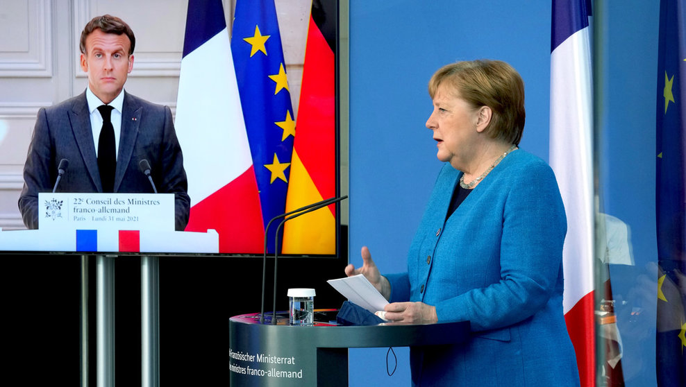 31 May 2021, Berlin: German Chancellor Angela Merkel holds a press conference via video with French President Emmanuel Macron after a plenary session of the Franco-German Council of Ministers, held via video conference. Photo: Michael Sohn/POOL AP/dpa