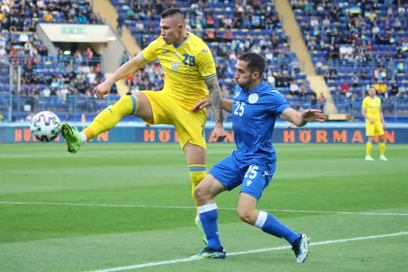 07 June 2021, Ukraine, Kharkiv: Ukraine's Oleksandr Zubkov and Cyprus' Andreas Panayiotou Filiotis in action during the International Friendly soccer match between Ukraine and Cyprus at Matalist Regional Sports Complex. Photo: -/Ukrinform/dpa