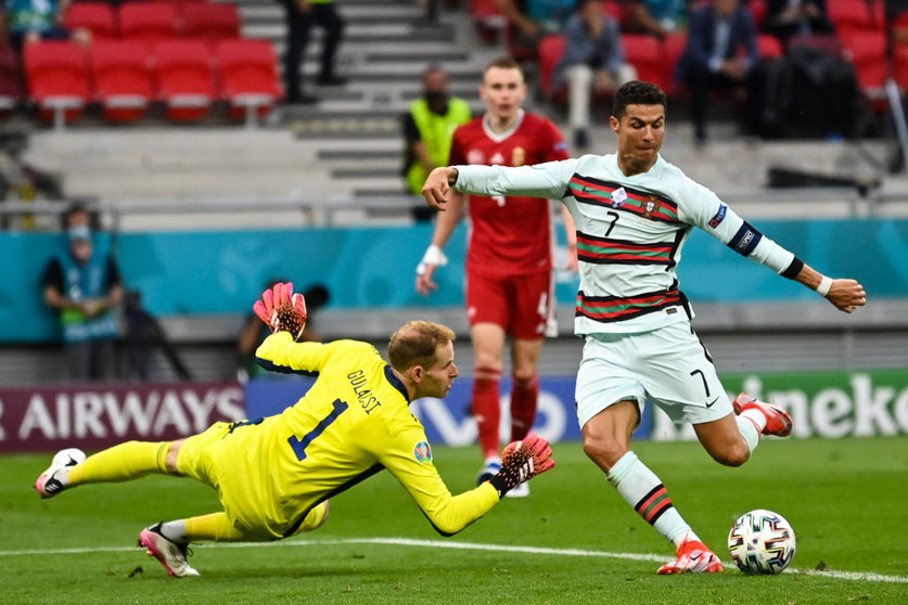 15 June 2021, Hungary, Budapest: Portugal's Cristiano Ronaldo scores his side's third goal during the UEFA EURO 2020 Group F soccer match between Hungary and Portugal at the Puskas Arena. Photo: Robert Michael/dpa-Zentralbild/dpa