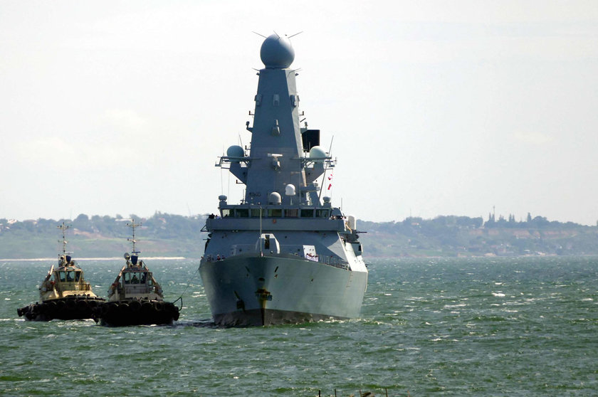 18 June 2021, Ukraine, Odesa: The Royal Navy destroyer HMS Defender arrives in the port of Odessa. The Russian military warned away the British Navy's HMS Defender warship with bombs and gunfire after it allegedly entered Russian territorial waters near the Crimean Peninsula on Wednesday, the TASS news agency reports. Photo: -/Ukrinform/dpa