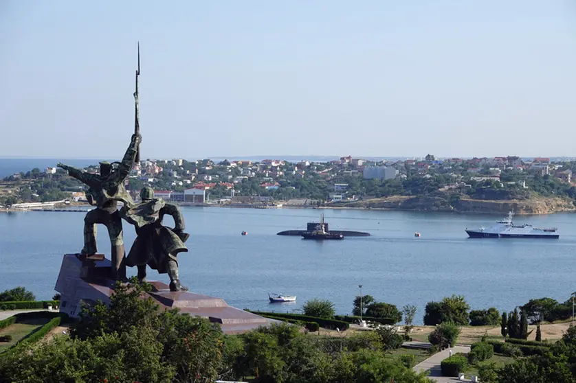 FILED - A submarine and warships of the Russian Black Sea Fleet lie at anchor in the port city of Sevastopol in 2019. The Russian military warned away a British warship with bombs and gunfire after it allegedly entered Russian territorial waters near the Crimean Peninsula on Wednesday, the TASS news agency reports. Photo: Ulf Mauder/dpa