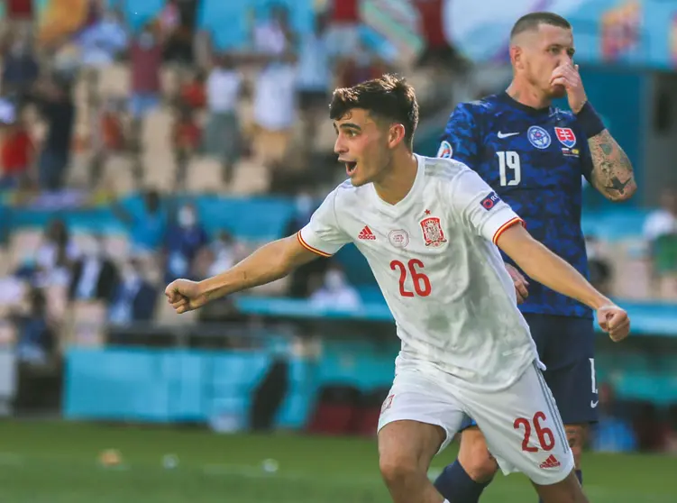 23 June 2021, Spain, Seville: Spain's Pedri celebrates his side's first goal during the UEFA EURO 2020 Group E soccer match between Slovakia and Spain at Estadio La Cartuja de Sevilla. Photo: Cezaro De Luca/dpa