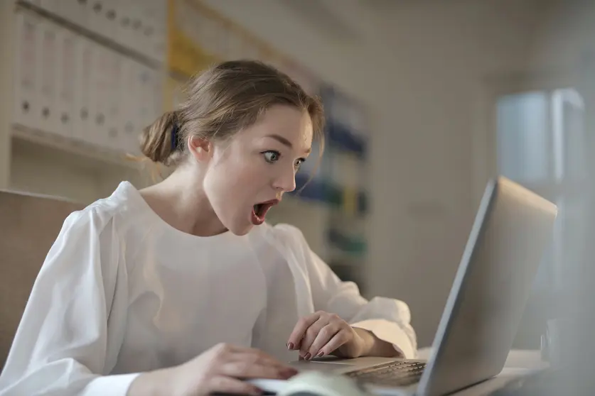 Woman surprise shock laptop computer. Photo by Andrea Piacquadio from Pexels.