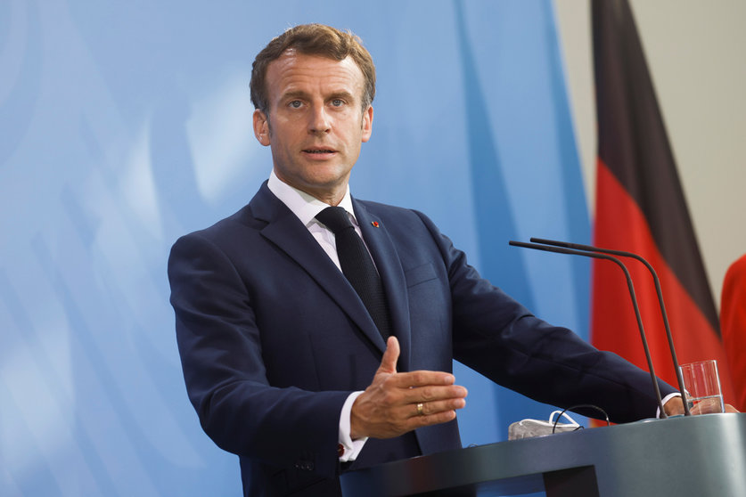 FILED - 18 June 2021, Berlin: French President Emmanuel Macron makes a statement to journalists together with German Chancellor Angela Merkel (not pictured). Macron will hold an extraordinary meeting of the Defense Council on the “Pegasus” hacking of his phone. Photo: Axel Schmidt/Reuters-Pool/dpa