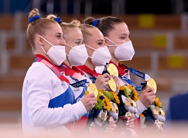 27 July 2021, Japan, Tokyo: (L-R) Gold medallist members of the Russian Olympic Committee team (ROC), Lilia Akhaimova, Viktoria Listunova, Angelina Melnikova and Vladislava Urazova celebrate on the podium during the medal ceremony of the Women's Team Artistic Gymnastics Final at the Ariake Gymnastics Centre, at the Tokyo 2020 Olympic Games. Photo: Marijan Murat/dpa