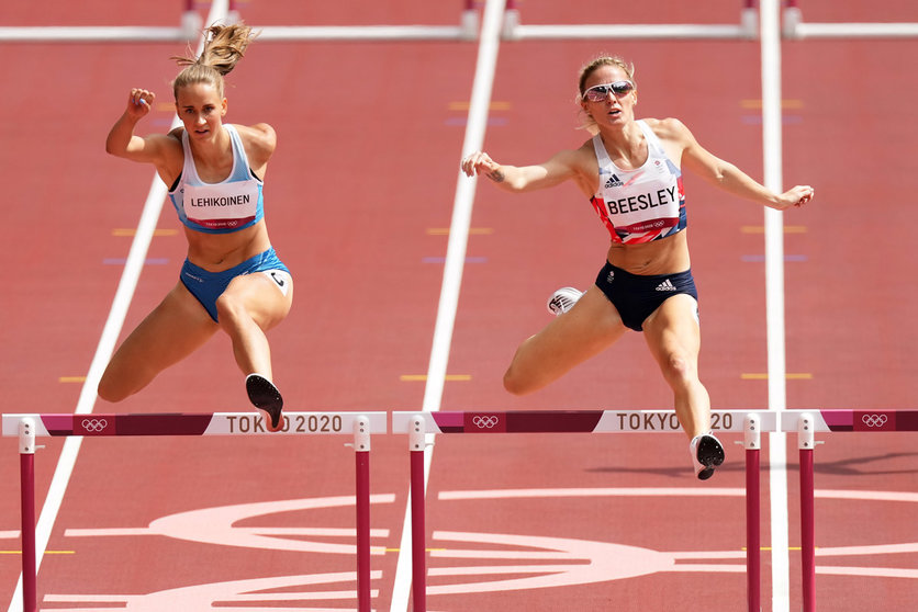 30 July 2021, Japan, Tokyo: Finland's Viivi Lehikoinen (L) and Great Britain's Meghan Beesley compete in the Women's 400m hurdles heats of the athletics competition, during the Tokyo 2020 Olympic Games. Photo: Martin Rickett/PA Wire/dpa