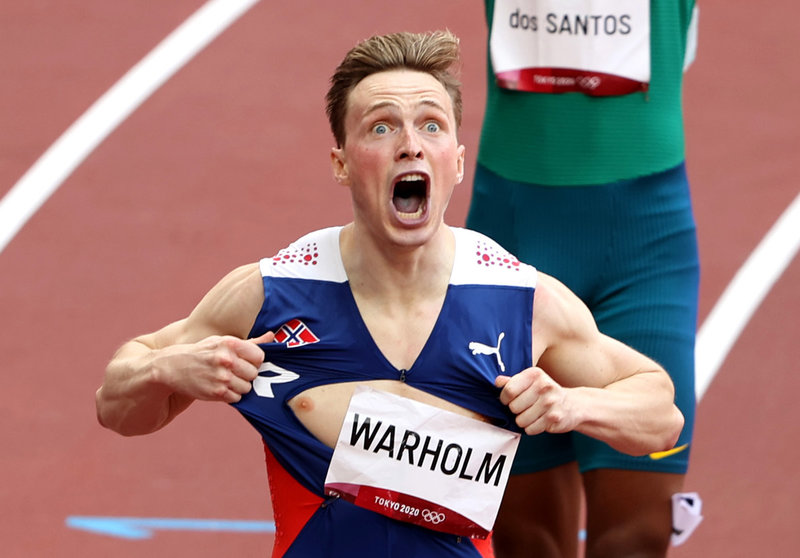 03 August 2021, Japan, Tokyo: Norway's Karsten Warholm celebrates gold after finishing the Men's 400m Hurdles Final of the athletics competition at the Olympic Stadium during the Tokyo 2020 Olympic Games. Photo: Oliver Weiken/dpa