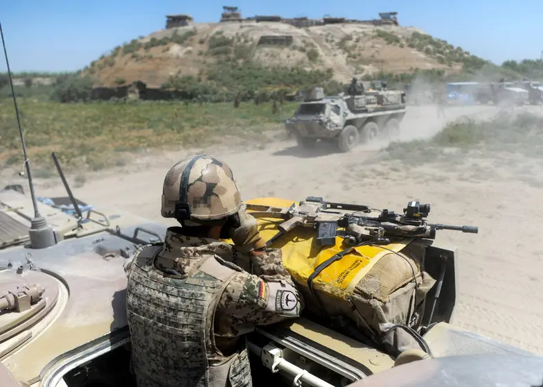 FILED - A German soldier patrols an area near Kunduz, Afghanistan, in 2011. In the wake of the departure of Western troops, the Taliban is making regular advances and, on Thursday, seized Herat, the country's third-largest city. Photo: Maurizio Gambarini/dpa