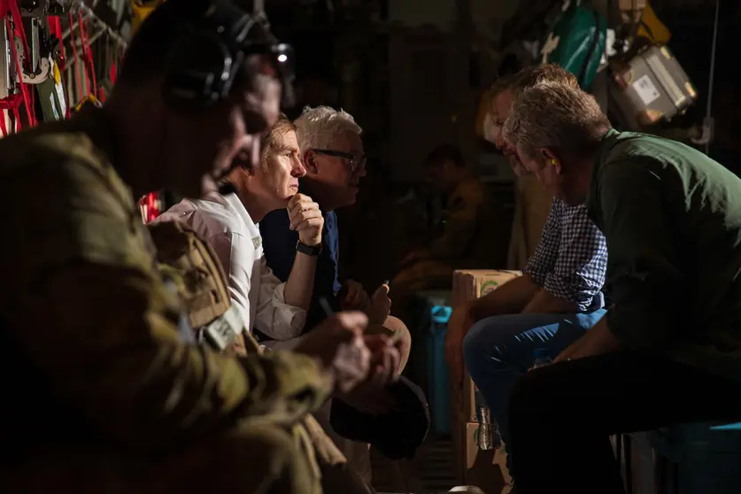 17 August 2021, Afghanistan, Kabul: Australian citizens sit inside a Royal Australian Air Force (RAAF) C-130 Hercules aircraft. The first Australian Defence Force evacuation flight has departed Kabul from Hamid Karzai International Airport with 26 evacuees on board. Photo: -/AUSTRALIAN DEFENCE FORCE via AAP/dpa