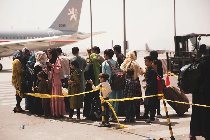 18 August 2021, Afghanistan, Kabul: Afghan civilians wait to board an aircraft during the evacuation process at Hamid Karzai International Airport. Photo: Ssgt. Victor Mancilla/U.S. Marin/Planet Pix via ZUMA Press Wire/dpa