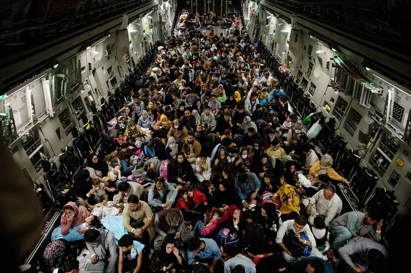 19 August 2021, Afghanistan, Kabul: Afghan citizens crowd on board US Air Force C-17 Globemaster III airplane as they are being evacuated from Hamid Karzai International Airport in Kabul. The evacuation is taking place due to the tense situation in Afghanistan after the takeover of the Taliban. Photo: Ssgt. Brandon Cribelar/U.S. Air/Planet Pix via ZUMA Press Wire/dpa