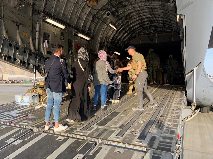 Evacuees from Afghanistan boarding a plane at Kabul international airport. Photo: Twitter/@Ulkoministerio.