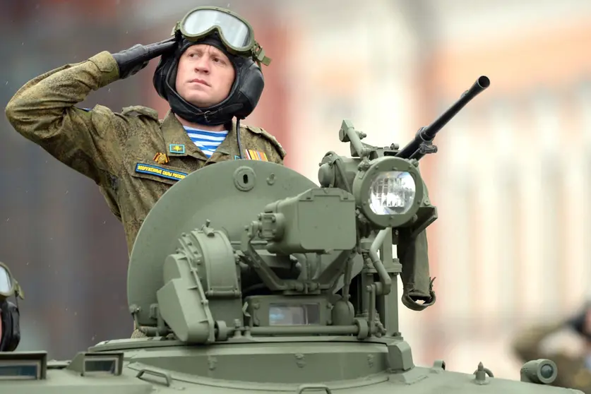 FILED - A Russian soldier salutes as he takes part in the Victory Day Military Parade in Red Square to mark the 76th anniversary of the Victory in the Great National War of 1941-1945. Photo: -/Kremlin/dpa - ATTENTION: editorial use only and only if the credit mentioned above is referenced in full