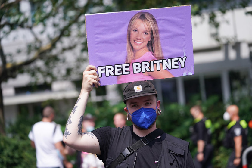 FILED - A banner reading "Free Britney" is seen at the Christopher Street Day (CSD) parade. The official motto of the CSD is "Save our Community - save our Pride", an allusion to the fact that many queer institutions fear for their existence because of the Corona crisis. The CSD is meant to remind people of the rights of lesbians, gays, bisexuals and intersexuals. Photo: Jörg Carstensen/dpa