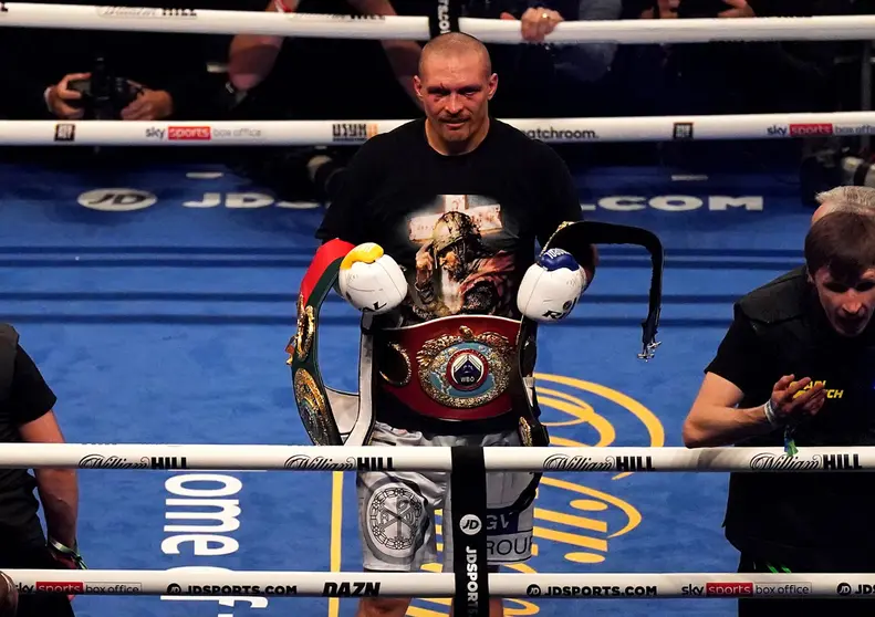 Ukrainian boxer Oleksandr Usyk celebrates after defeating Britain's Anthony Joshua in the WBA, WBO, IBF and IBO World Heavyweight titles boxing match at the Tottenham Hotspur Stadium. Photo: Nick Potts/PA Wire/dpa