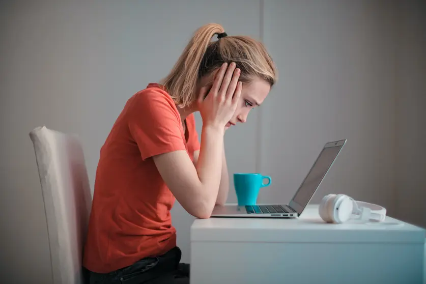 Woman laptop work sad desperate computer by Pexels.