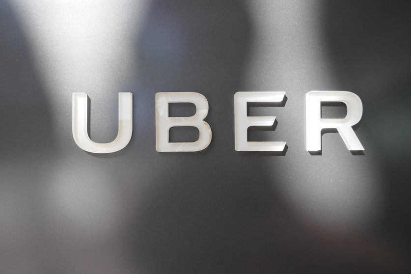 FILED - The Uber company logo at the company's headquarters. France's top court has ruled that a former Uber driver was an employee of the ride-hailing platform, in a decision with potentially fraught consequences for the company's business model. The Court of Cassation approved an appeal court judgement in a case taken by a driver after the company closed his account. Photo: Christoph Dernbach/dpa.