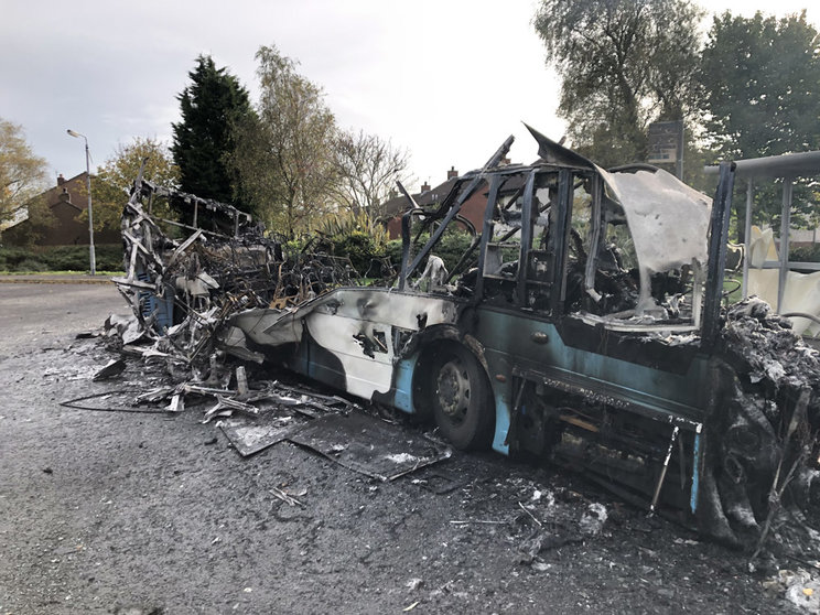 A general view of a destroyed bus on Abbott Drive where assailants hijacked and set the vehicle alight in an attack politicians have linked to loyalist opposition to Brexit's Northern Ireland Protocol. Photo: David Young/PA Wire/dpa.