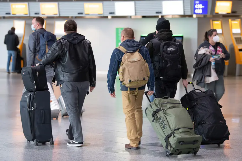 Passengers move through Frankfurt Airport on Friday. The European Commission says it wants to limit air travel from southern African into the bloc due to fears about a new Covid-19 variant discovered there, following similar moves announced by Britain and Israel. Photo: Boris Roessler/dpa.