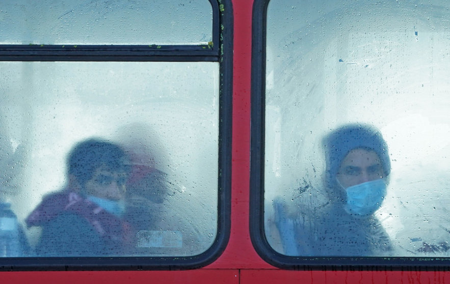 25 November 2021, United Kingdom, Dover: A group of people thought to be migrants sit on a bus after arriving in Dover, Kent, following a small boat incident in the Channel. 27 migrants died yesterday after their boat capsized in the English Channel, the French Interior Ministry has said. Photo: Gareth Fuller/PA Wire/dpa.