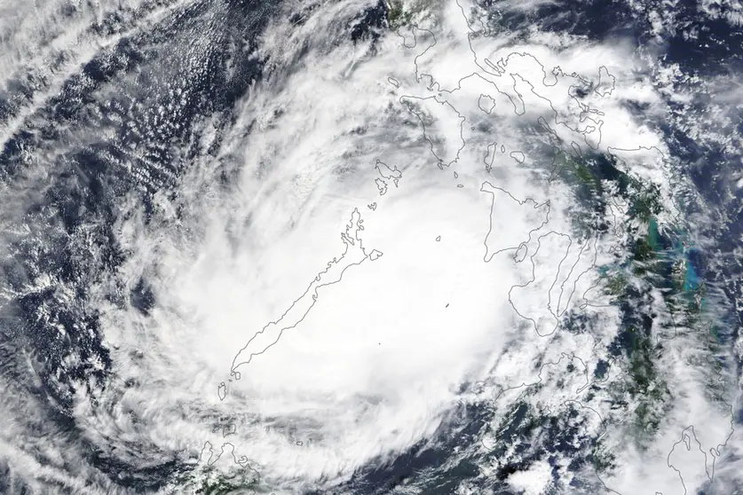 HANDOUT - 17 December 2021, ---: An image aquired via the Moderate Resolution Imaging Spectroradiometer (MODIS) on NASA's Terra satellite shows the typhoon Rai sweeping through the western side of the Philippines. Emergency teams in the Philippines on Saturday rushed aid to areas battered by the strongest typhoon to hit the country this year, which killed up to 24 people and displaced more than 330,000. Photo: -/Nasa Earth via ZUMA Press Wire Service/dpa - ATTENTION: editorial use only and only if the credit mentioned above is referenced in full.