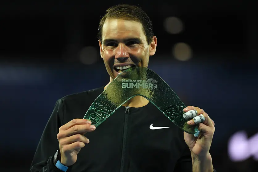 09 January 2022, Australia, Melbourne: Spanish tennis player Rafael Nadal celebrates with the trophy after defeating USA's Maxime Cressy in their Men's Singles Final tennis match on Day 7 of the Melbourne Summer Set tennis tournament at Melbourne Park. Photo: James Ross/AAP/dpa.