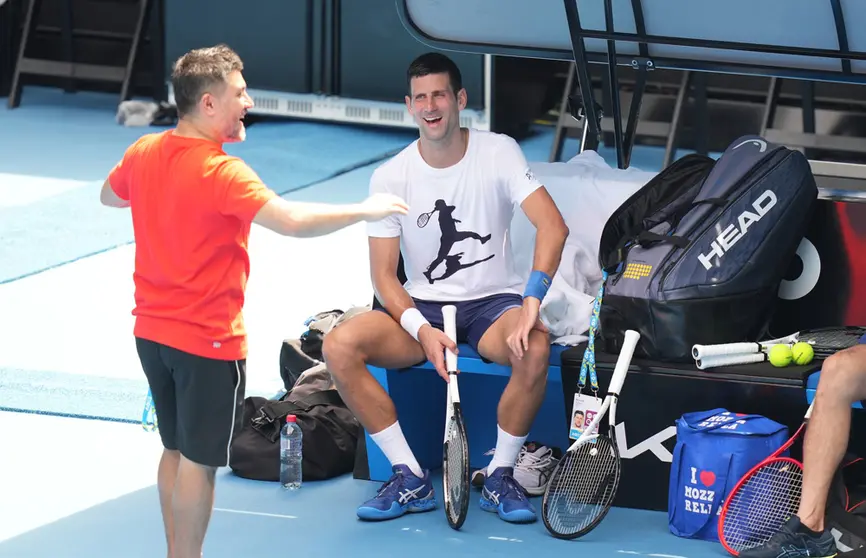 11 January 2022, Australia, Melbourne: Serbian tennis player Novak Djokovic (R) takes part in a practice session ahead of the Australian Open at Melbourne Park. The court had yesterday upheld an appeal from Djokovic against the cancellation of his visa in connection with coronavirus rules. Photo: Scott Barbour/TENNIS AUSTRALIA via AAP/dpa.