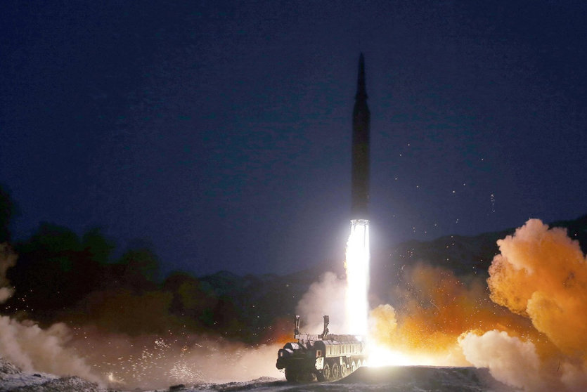 HANDOUT - 11 January 2022, North Korea, ---: A picture provided by the North Korean Central News Agency (KCNA) shows a missile launching from a mobile launch pad. North Korea's National Defence Academy said it was a test launch of a hypersonic missile. Photo: -/KCNA/dpa.