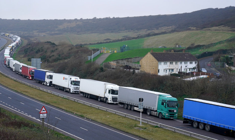 11 January 2022, United Kingdom, Dover: Lorries queue on the A20 for the Port of Dover in Kent, where delays are being caused to the transportation of goods across the channel after exports between Great Britain and the EU became subject to full customs controls on 1 January 2022. Photo: Gareth Fuller/PA Wire/dpa.