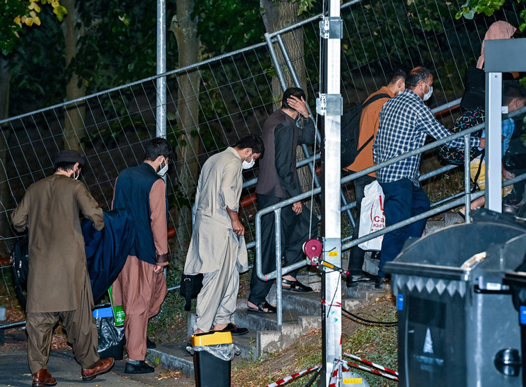 FILED - 20 August 2021, Brandenburg, Doberlug-Kirchhain: Local forces from Afghanistan walk to their accommodation on the grounds of the DRK Refugee Aid at the Initial Reception Centre in the early morning. About 71,400 applications for asylum were lodged in the European Union and associated countries in November, up by 9 per cent from October and the second-highest level since the refugee crisis of 2016, an EU authority said on Friday. Photo: Patrick Pleul/dpa-Zentralbild/dpa.