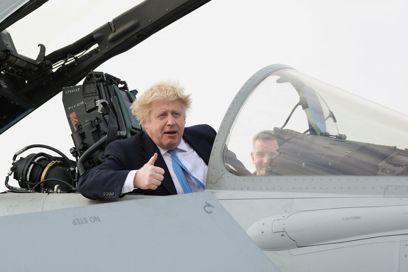 17 February 2022, United Kingdom, Waddington: UK's Prime Minister Boris Johnson sits a military plane during his visit to meet military personnel at Royal Air Force Station Waddington. Photo: Carl Recine/PA Wire/dpa