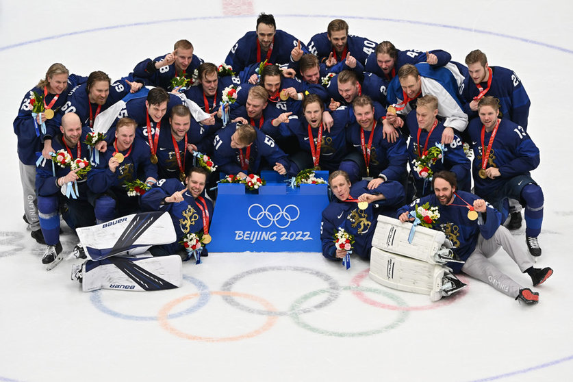 20 February 2022, China, Beijing: Finland players celebrate with their gold medals after the Men's Ice Hockey Gold medal match between Finland and Russian Olympic Committee at Beijing National Indoor Stadium, during Beijing 2022 Winter Olympic Games. Photo: Peter Kneffel/dpa.