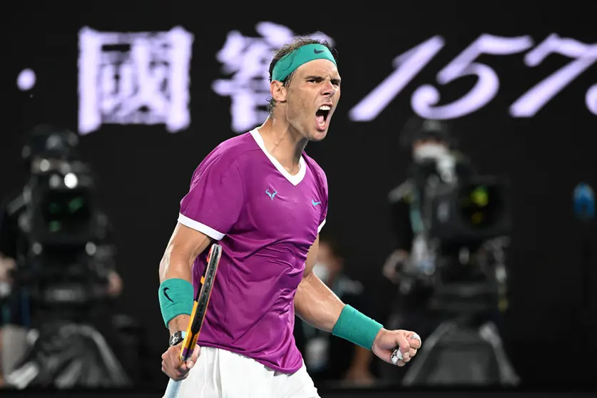 30 January 2022, Australia, Melbourne: Spanish tennis player Rafael Nadal celebrates winning the third set during his Men's Singles Final tennis match against Russia's Daniil Medvedev on Day 14 of the Australian Open at Melbourne Park. Photo: Dave Hunt/AAP/dpa.