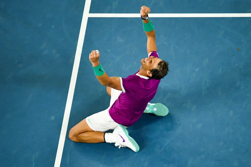 31 January 2022, Australia, Melbourne: Spanish tennis player Rafael Nadal celebrates defeating Russia's Daniil Medvedev to win their Men's Singles Final tennis match of the Australian Open. Photo: James Ross/AAP/dpa.