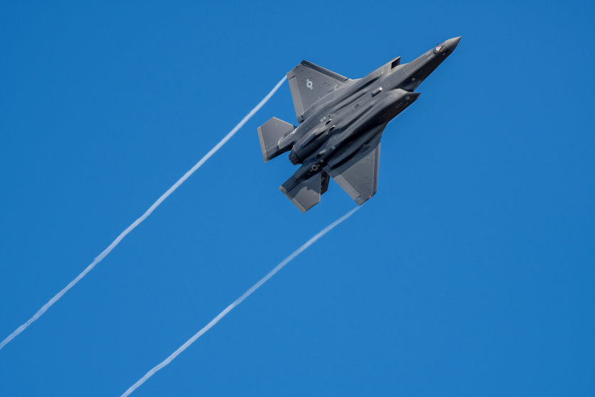 23 February 2022, Rhineland-Palatinate, Spangdahlem: A US F-35 jet fighter flies over Germany's Eifel mountain range. The US Armed Forces have already transferred stealth fighter jets to Spangdahlem Air Base a few days ago. Photo: Harald Tittel/dpa.