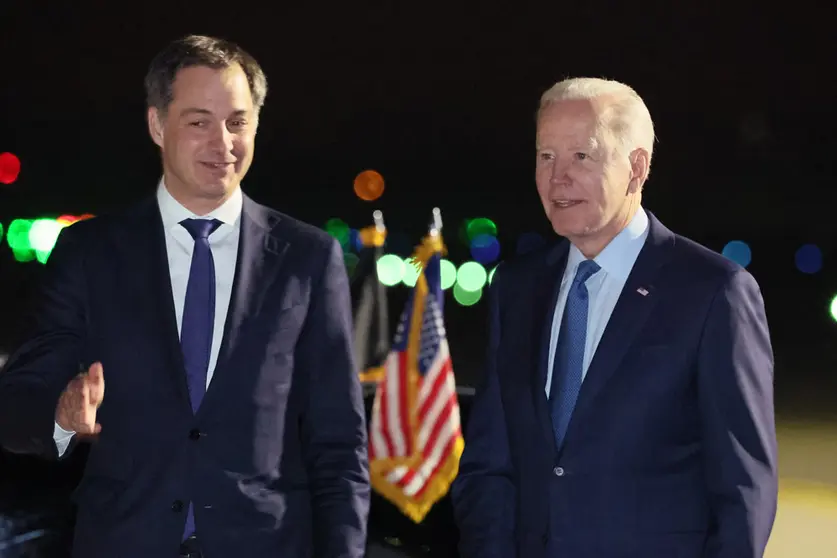 23 March 2022, Belgium, Steenokkerzeel: Belgian Prime Minister Alexander De Croo (L) welcomes US President Joe Biden upon his arrival at the military airport in Melsbroek. Biden is to discuss the conflict in Ukraine with EU leaders at a summit on Thursday, following a meeting of NATO leaders Photo: Benoit Doppagne/BELGA/dpa.