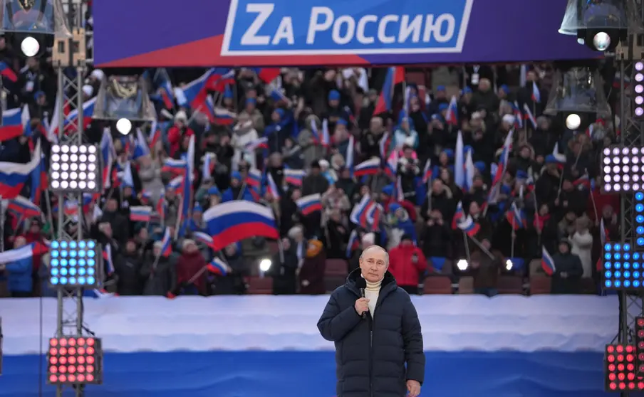 HANDOUT - 18 March 2022, Russia, Moscow: Russian President Vladimir Putin delivers a speech during a concert held to mark the eighth anniversary of Russia's annexation of Crimea at the Luzhniki stadium. Photo: -/Kremlin/dpa - ATTENTION: editorial use only and only if the credit mentioned above is referenced in full.