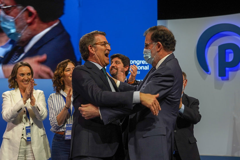 02 April 2022, Spain, Seville: Spanish former prime minister Mariano Rajoy greets newly-elected President of the Spanish conservative People's Party (PP), Alberto Nunez Feijoo, after th latter delivered a speech on the second and last day of the PP national congress. Photo: Eduardo Briones/EUROPA PRESS/dpa.