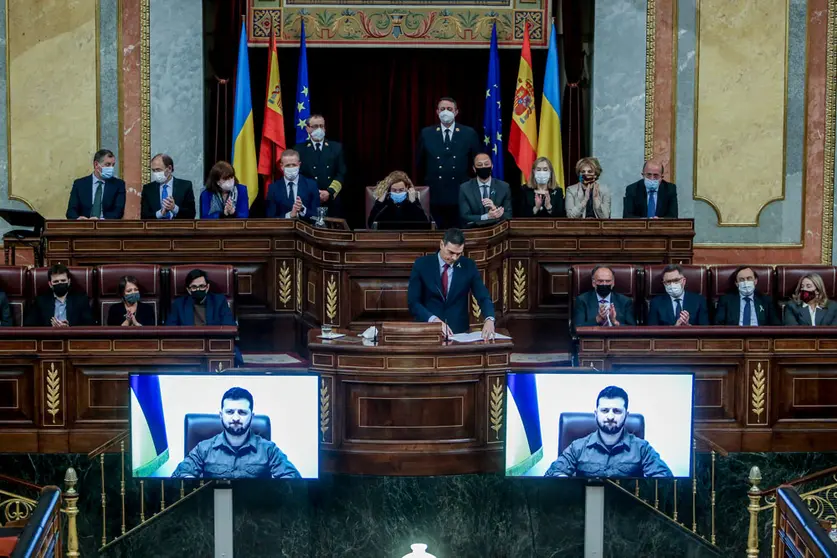 05 April 2022, Spain, Madrid: Spanish Prime Minister Pedro Sanchez listens to the speech of the Ukrainian President Volodymyr Zelensky to the Spanish deputies and senators via video transmission at the Congress of Deputies. Photo: R.Rubio.Pool/EUROPA PRESS/dpa.