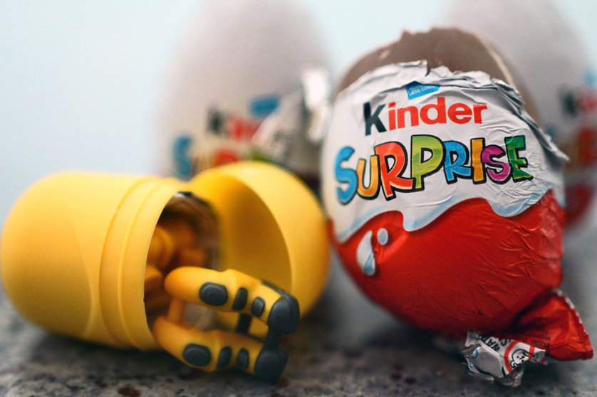 04 April 2022, United Kingdom, London: A toy lies next to a British variant of a Kinder Surprise egg. Due to more than 60 cases of salmonella illnesses in the UK, Ferrero has recalled some batches of children's surprise eggs just under two weeks before Easter. Photo: Victoria Jones/PA Wire/dpa.
