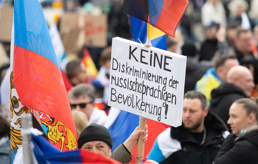 10 April 2022, Hessen, Frankfurt/Main: People hold a placard during a pro-Russian demonstration. Photo: Boris Roessler/dpa.